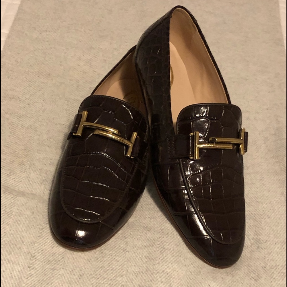 Tod’s Double T brown loafer. Never used.With tags. Gold hardware